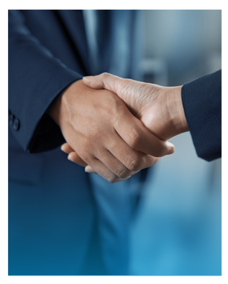 Close-up of two professionals shaking hands, symbolizing a successful business partnership